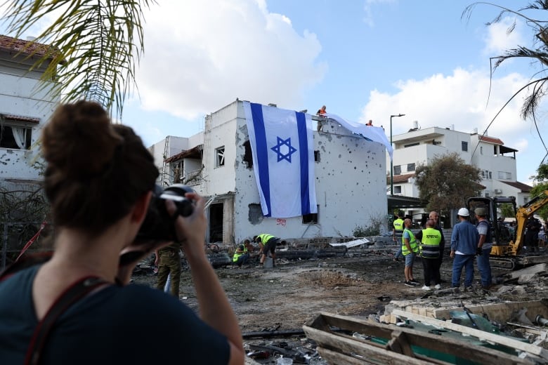 Hezbollah fires dozens of rockets deeper into Israel, as IDF launches more strikes on Lebanon | CBC News