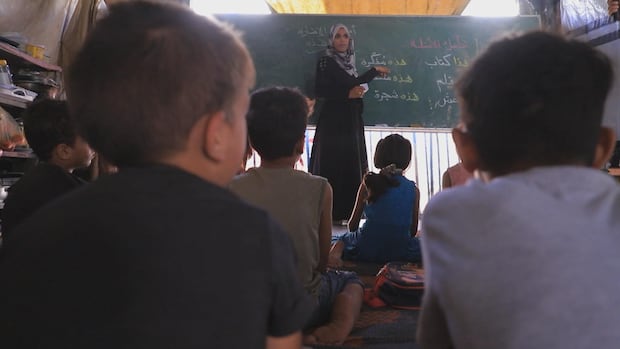 Nearly 1 year into the war, some students in Gaza go back to school | CBC News