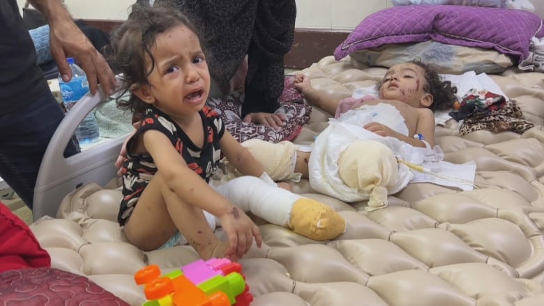 Palestinian toddlers lost limbs to an Israeli airstrike as soon as humanitarin pause lifted | CBC News