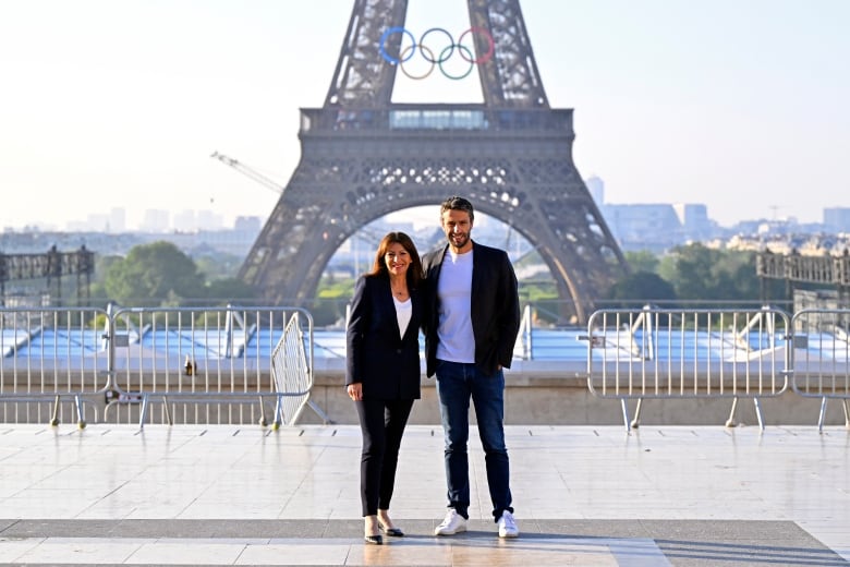 Paris mayor wants to keep Olympic rings on the Eiffel Tower. Not everyone is pleased | CBC Radio
