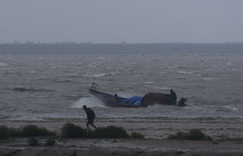 India braces for impact of Dana, as officials aim to get hundreds of thousands away from storm