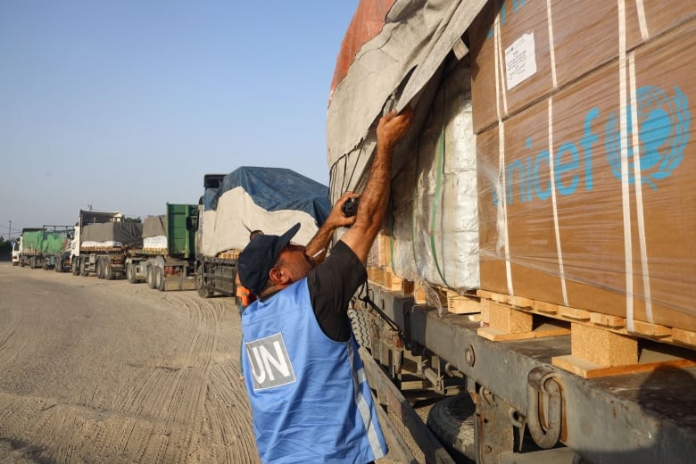 Trucks carrying aid into Gaza are being violently ransacked. Here's what we know