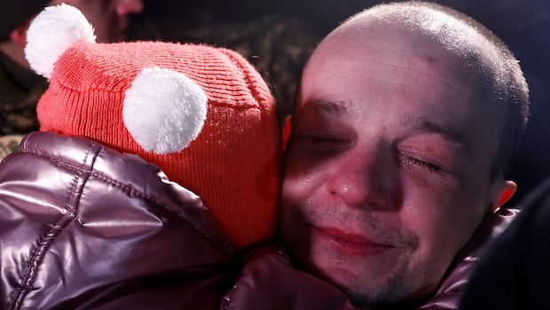 Hundreds of Ukrainian and Russian POWs head home after swap