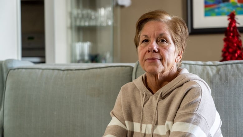 Ottawa mother 'walked through fire' to save son from burning house, family member says