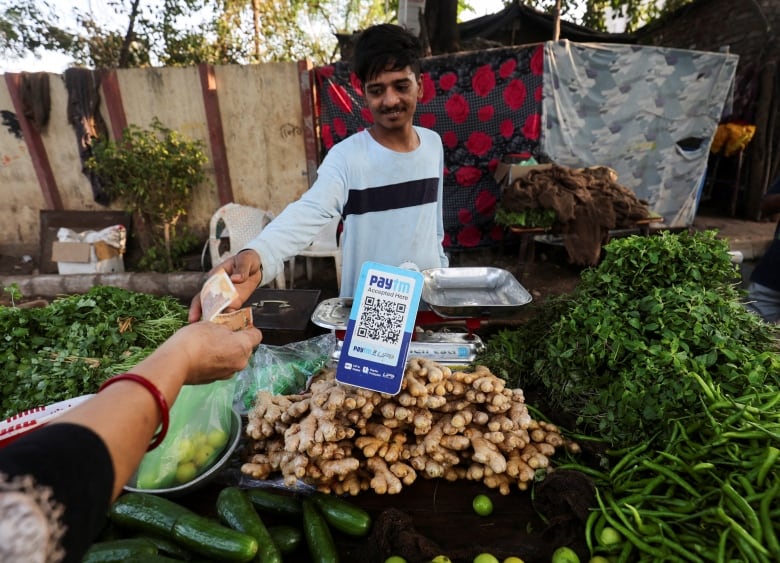 Spare some digital change? In India, many transgender people use QR codes to beg