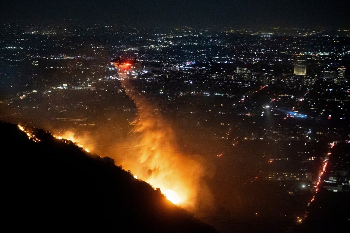 At least 5 dead in wildfires raging through L.A., destroying nearly 2,000 structures