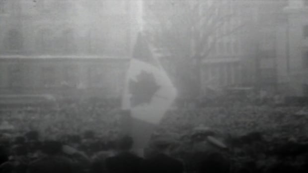 Canada's Maple Leaf flag is 60. This veteran at the unveiling pens love letter to the red and white