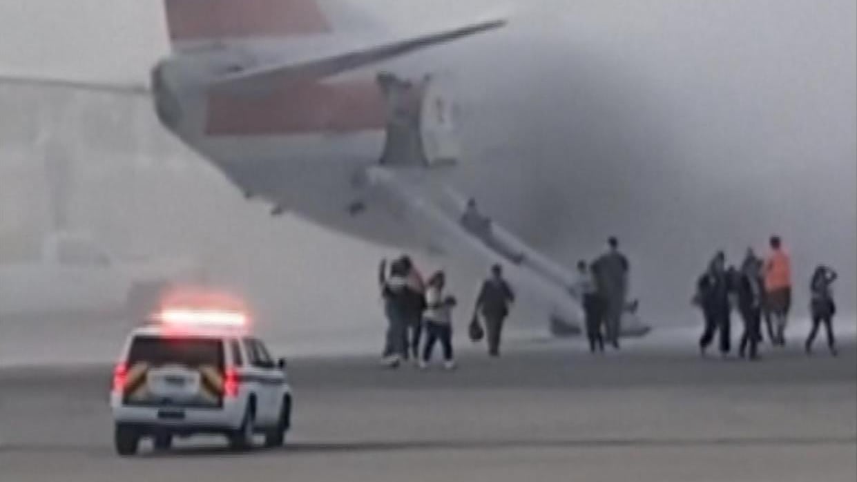 175 passengers evacuated as American Airlines plane catches fire