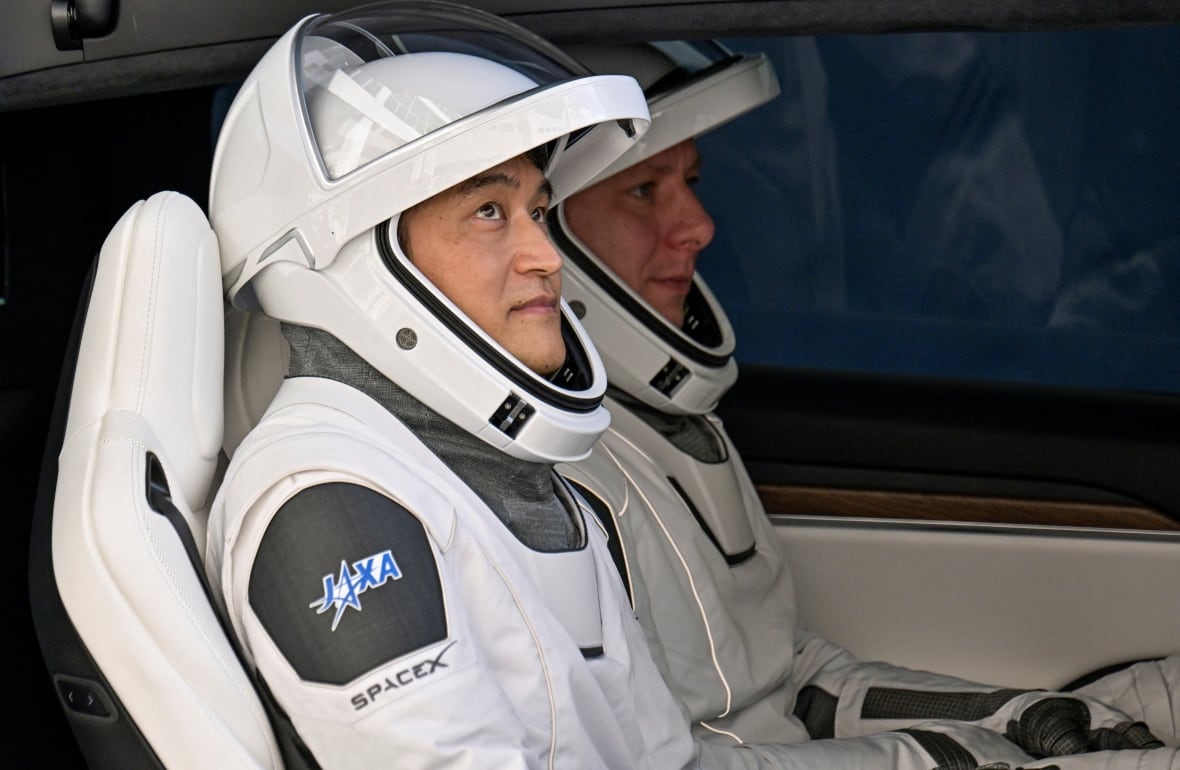 Space crew docks at ISS to replace 2 astronauts stranded for 9 months