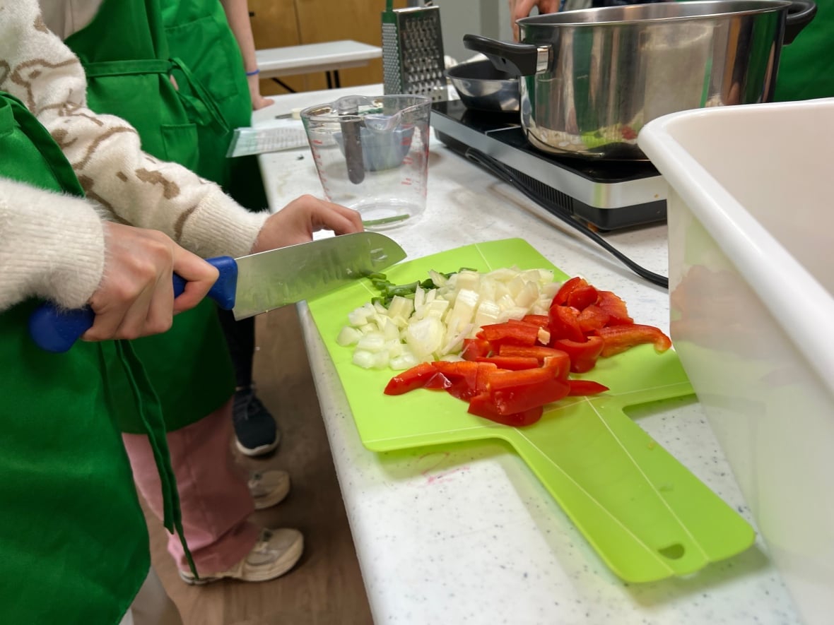As these kids get hands-on with food, they're also learning about climate change