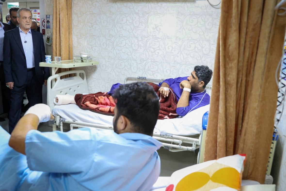 Iran president visits injured, calls for probe into port explosion that killed dozens