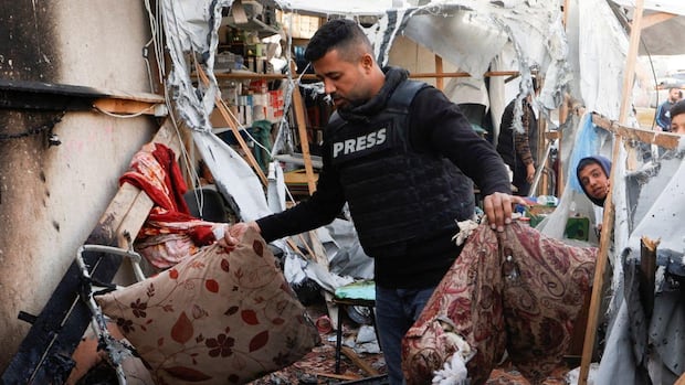 Palestinian journalist killed, 9 wounded, after Israeli strike hits media tent, medics say