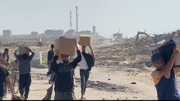 Droves of Palestinians overwhelm new Gaza aid centre in Rafah as warning shots ring out