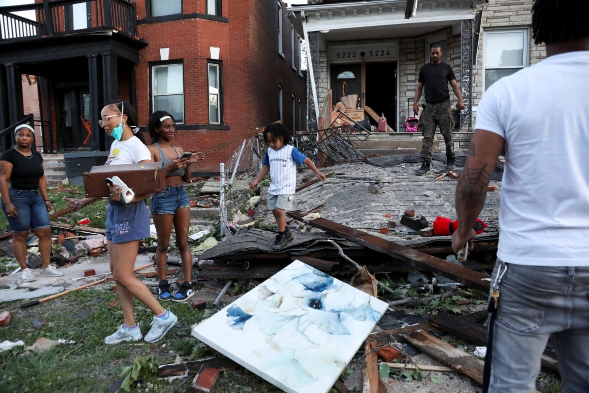 Severe storms sweep through Kentucky, killing at least 21 people, after tornado batters Missouri