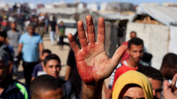 Israeli troops fatally shoot 32 Palestinians trying to reach aid sites: Gaza officials