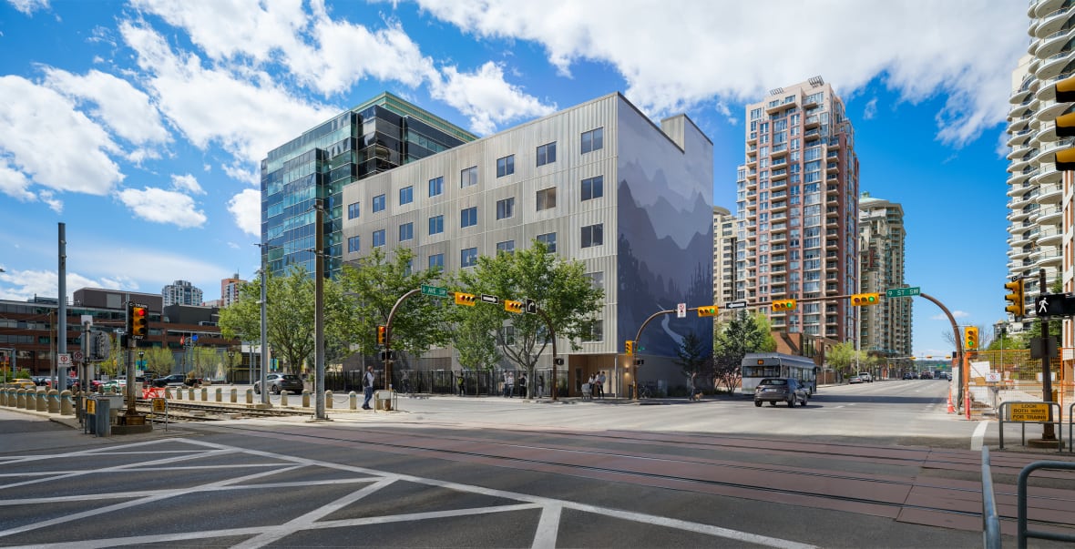 Piece by piece, cranes lift 84 prefabricated rental units into place in downtown Calgary