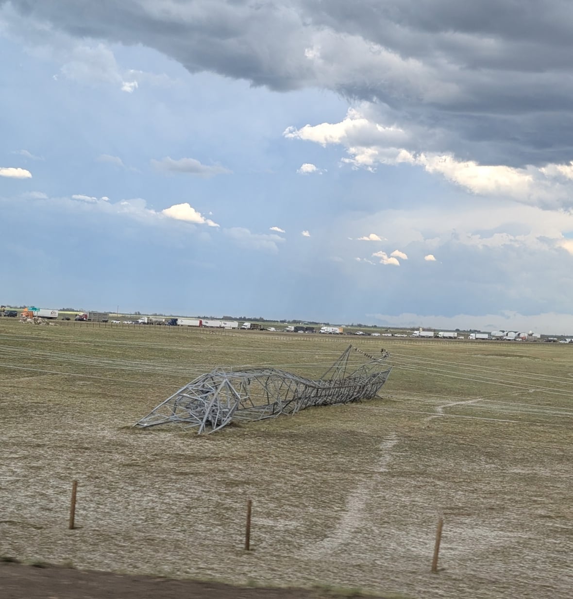 Severe thunderstorm in southern Alberta downs power lines, damages cars