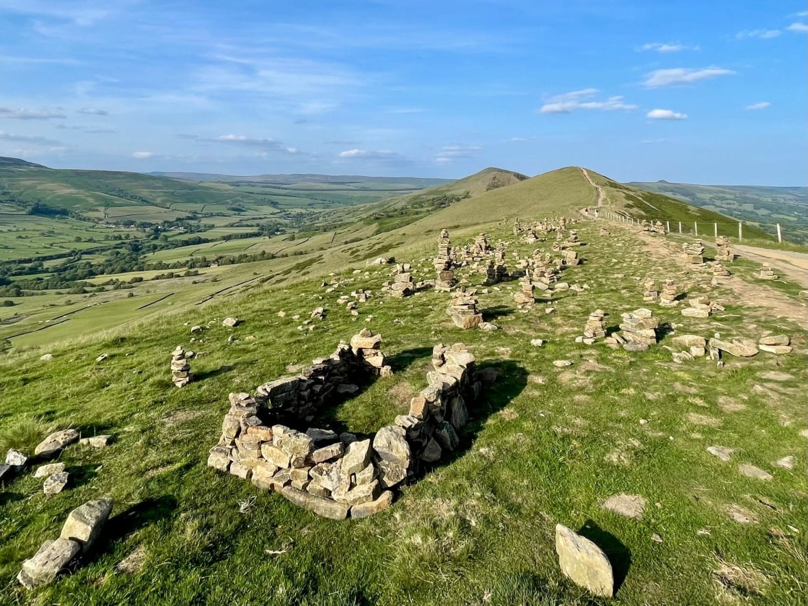 This hiker kicks over people's picturesque stone stacks. But he's got a good reason