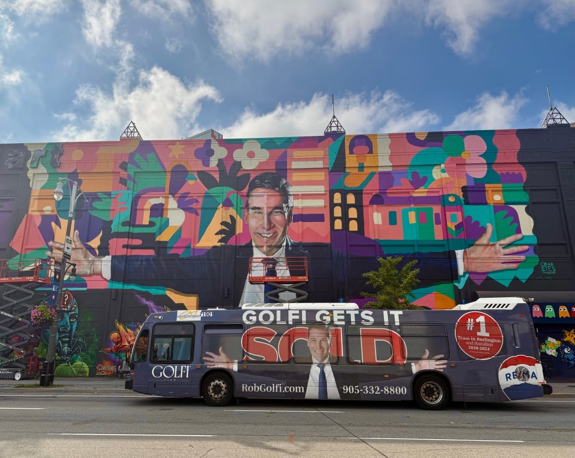 Art or ad? Giant portrait of Hamilton real estate agent raises eyebrows as artist defends 'gesture of thanks'