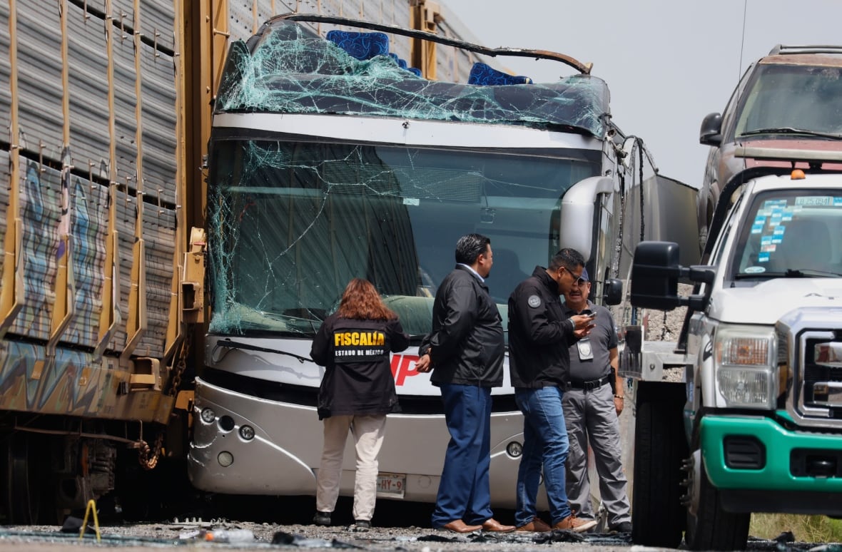 Freight train slams into a bus outside Mexico City, killing at least 10 people