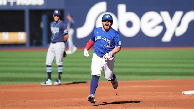 Kirk hits 2 homers as Blue Jays thump Rays to clinch division, top seed in American League