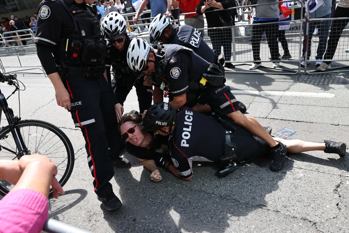 TIFF screening of Oct. 7 documentary brings protesters and a standing ovation for its director