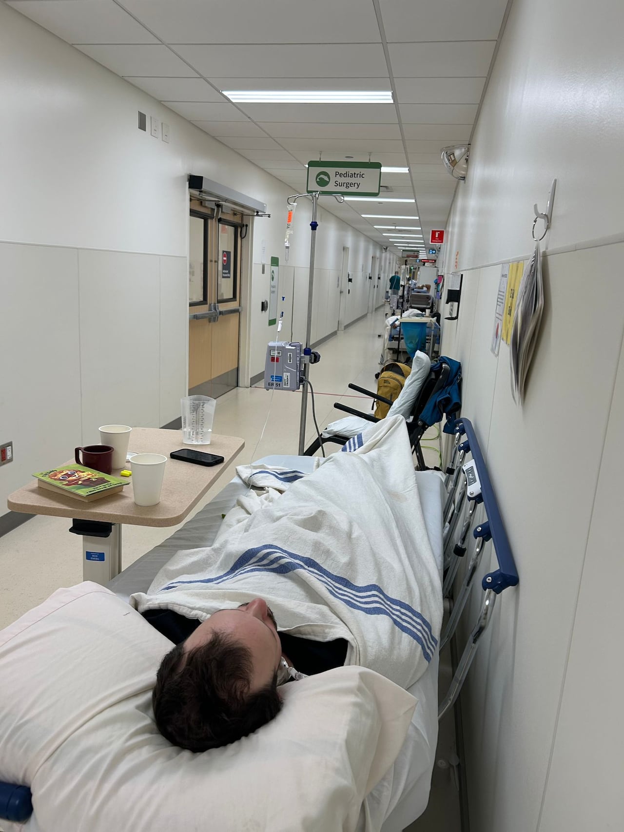 Saskatoon man undergoes invasive medical procedures in hospital hallway due to overcapacity