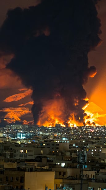 Black rain is falling in Iran after strikes on oil facilities. Scientists warn of long-term consequences