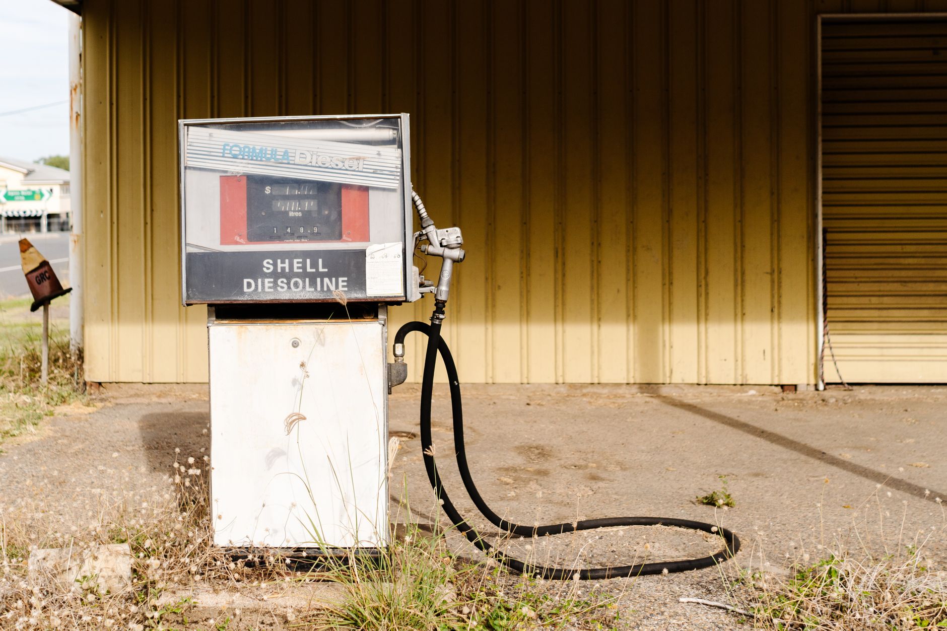 A vintage gas pump with Shell branding at an old, abandoned station in Miriam Vale, QLD, Australia.