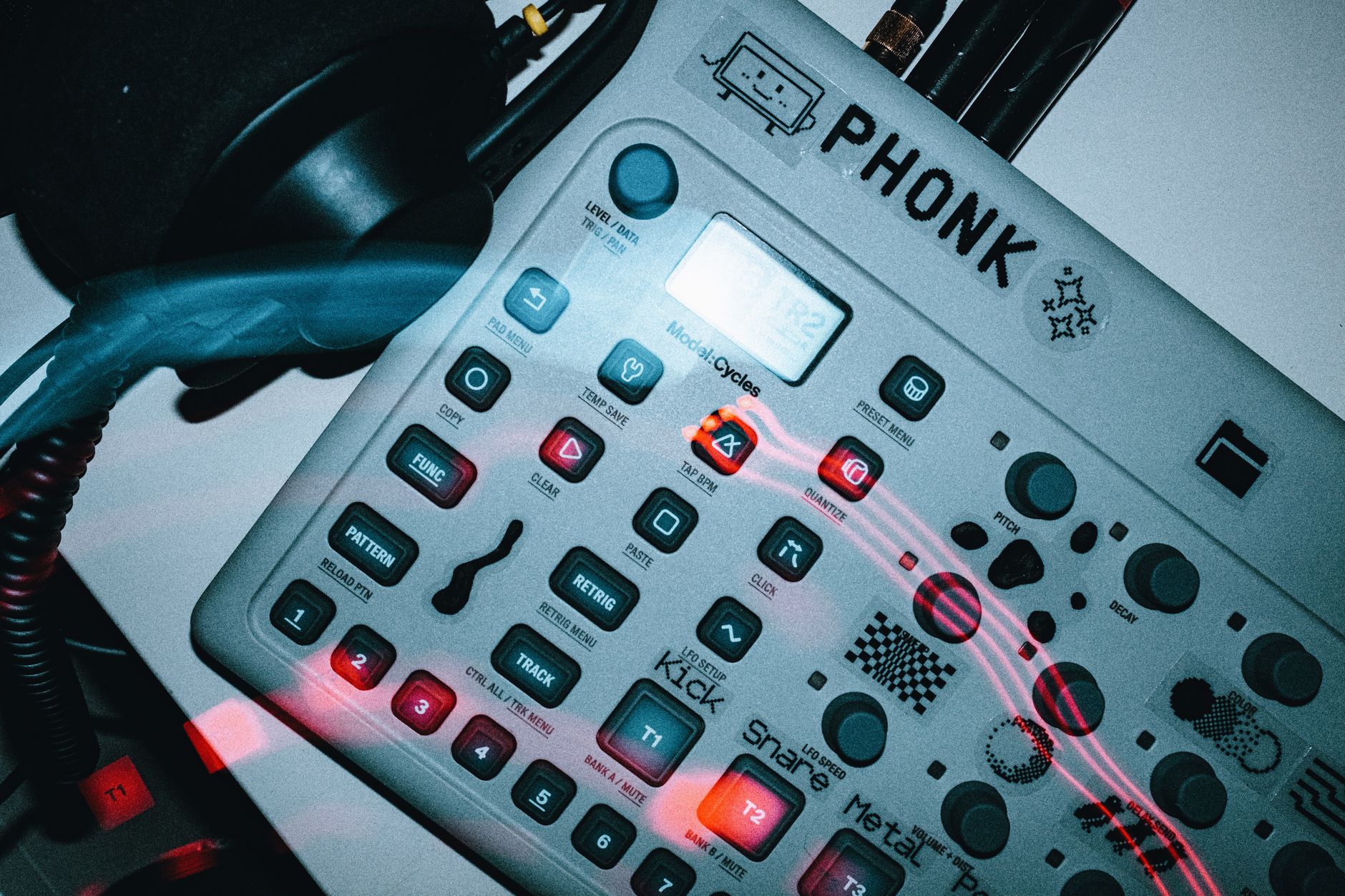 Detailed view of an electronic music synthesizer device labeled 'PHONK'.